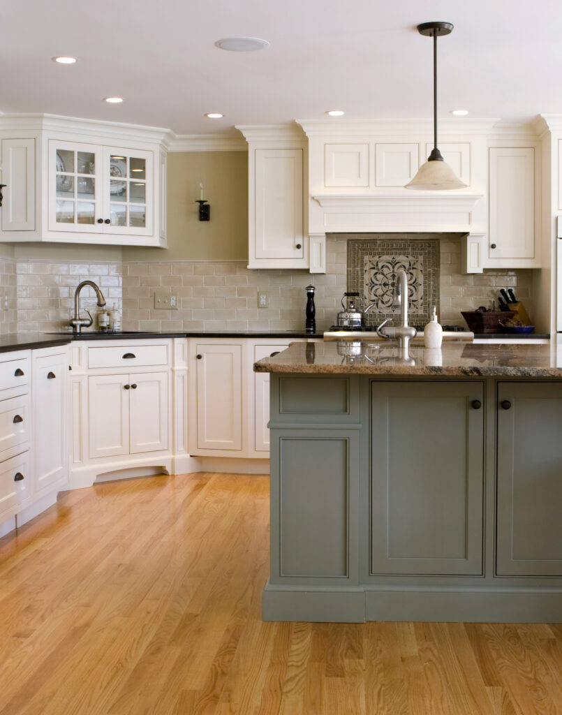 Kitchen with white and green cabinetry
